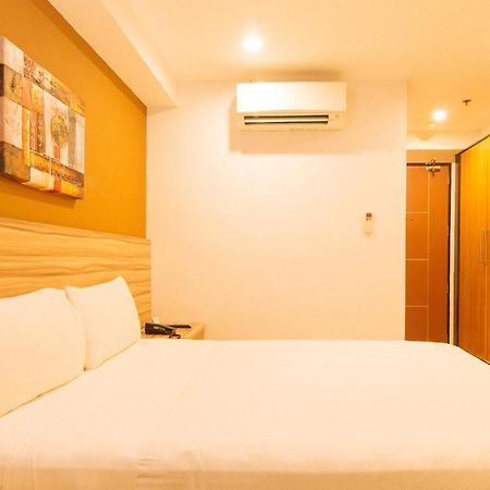 Guijo Suites Makati Макати Экстерьер фото