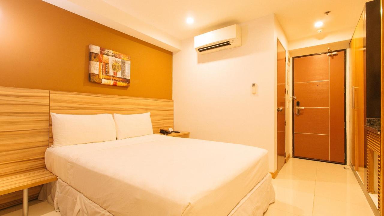 Guijo Suites Makati Макати Экстерьер фото