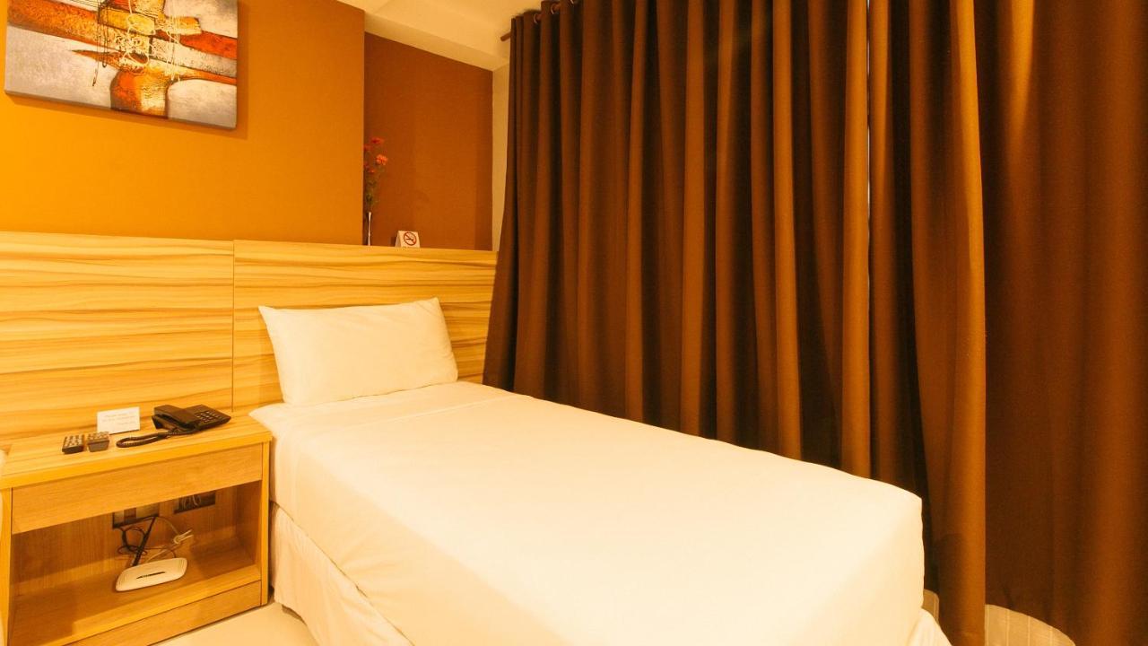 Guijo Suites Makati Макати Экстерьер фото
